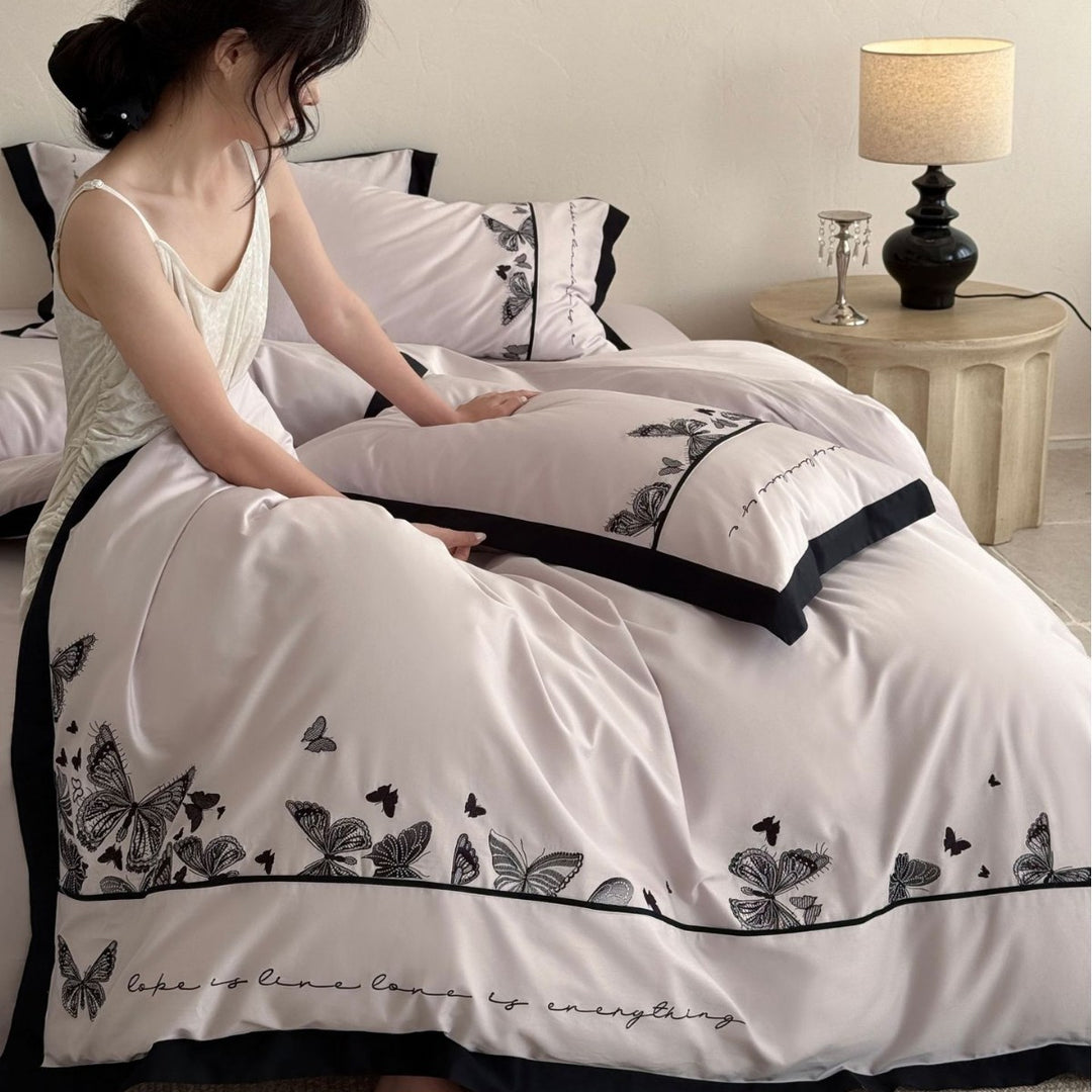 Bedding set with butterfly embroidery and contrast piping