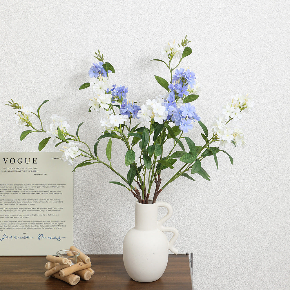 Decorative art branch with white flowers