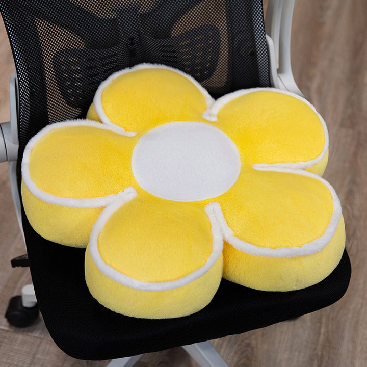 Padded seat cushion in flower shape with faux leather center piece and fluffy edge padding