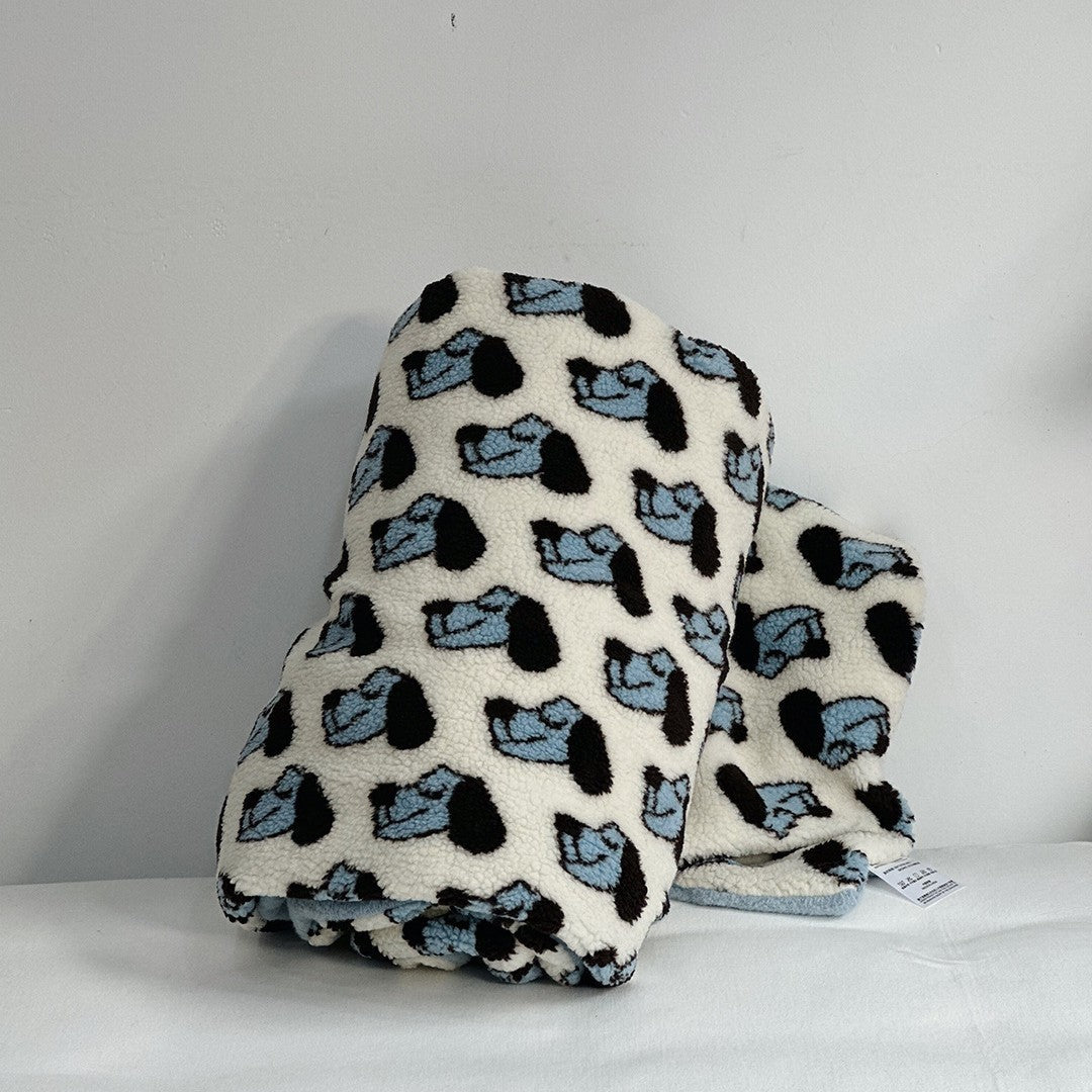 Plush Sherpa throw blanket with abstract pattern and extra-soft teddy fleece