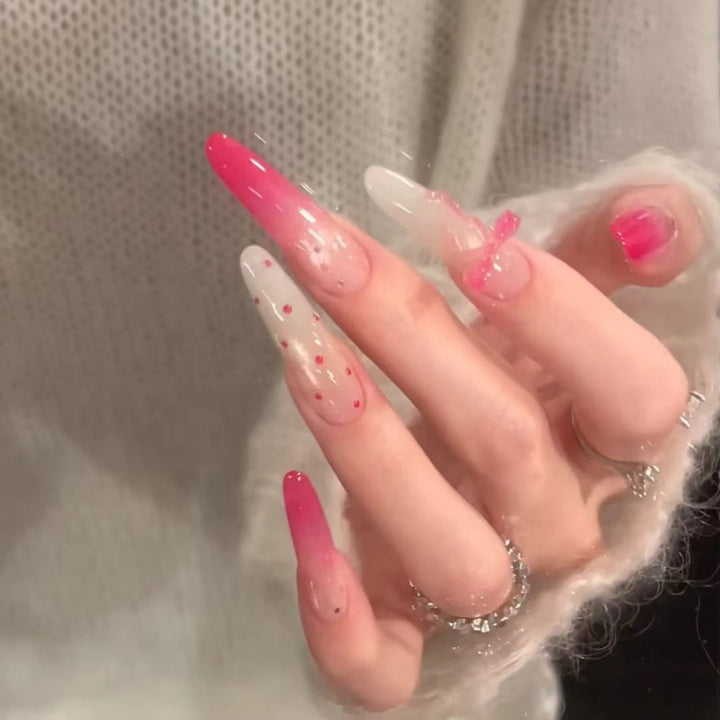 Artistic Gradient Nail Extensions with Decorative Accents