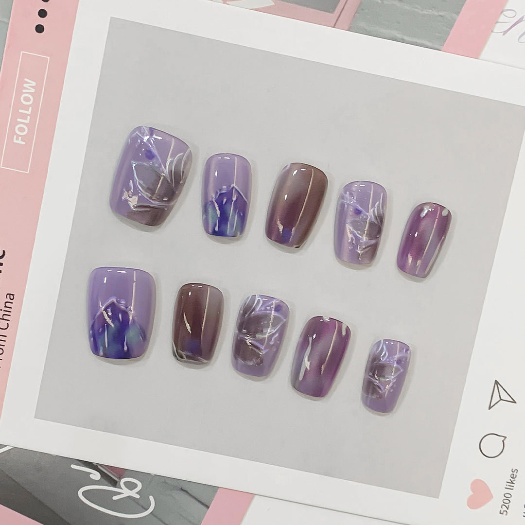 Artful acrylic nails with marbled design Kalsten