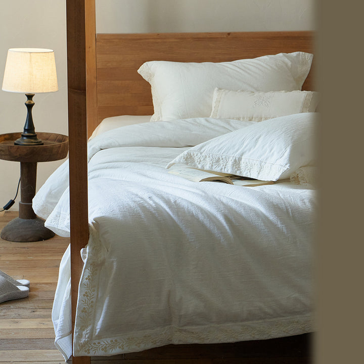 Cotton gauze bedding set with fine tone-on-tone floral embroidery and ruffle