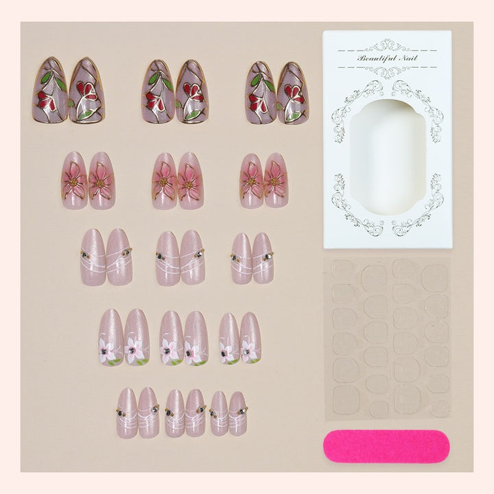 Nail art set with filigree floral decorations and shiny details Kalsten