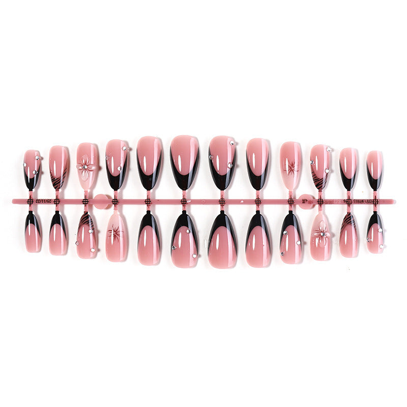 Acrylic nail set with elegant glitter and flower accents Kalsten