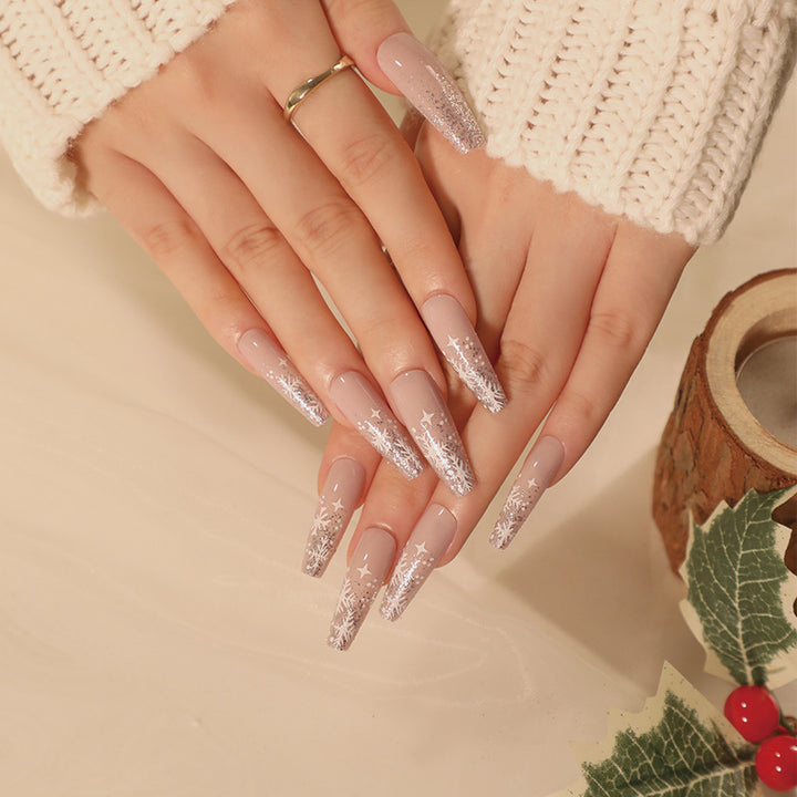 Artful nail art in winter design with glitter and snowflakes Kalsten