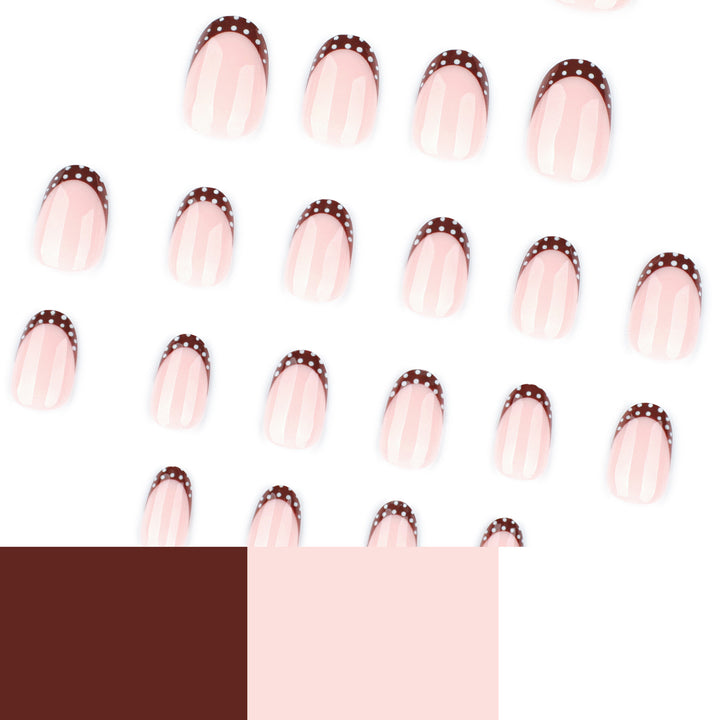 Artful nail design with elegant French tip and accents Kalsten