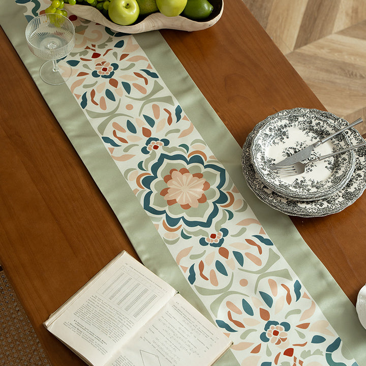 Handcrafted satin table runner with Oriental medallion pattern and decorative tassels