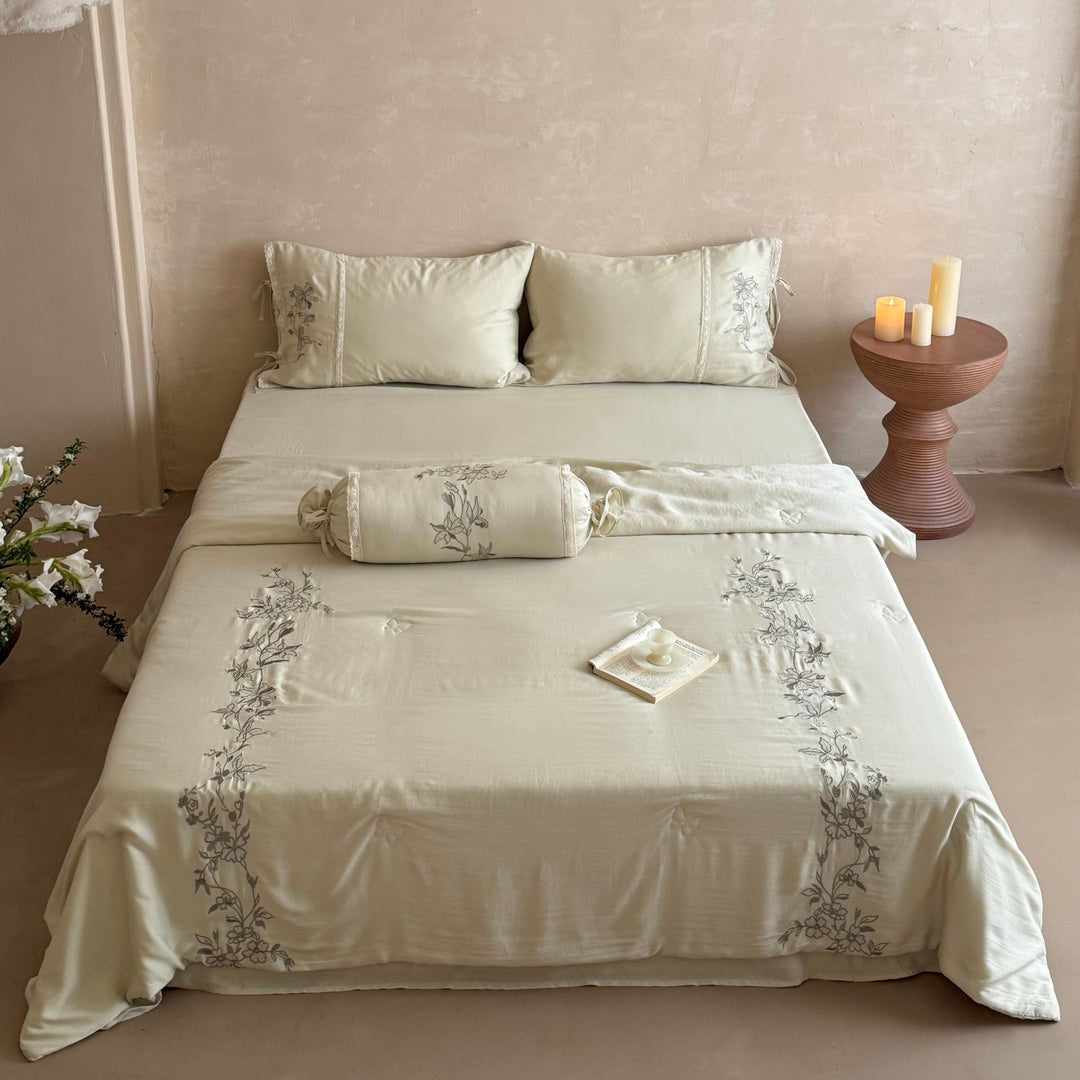 Elegant bedding set made of cotton satin with floral embroidered border and decorative roll cushion Kalsten