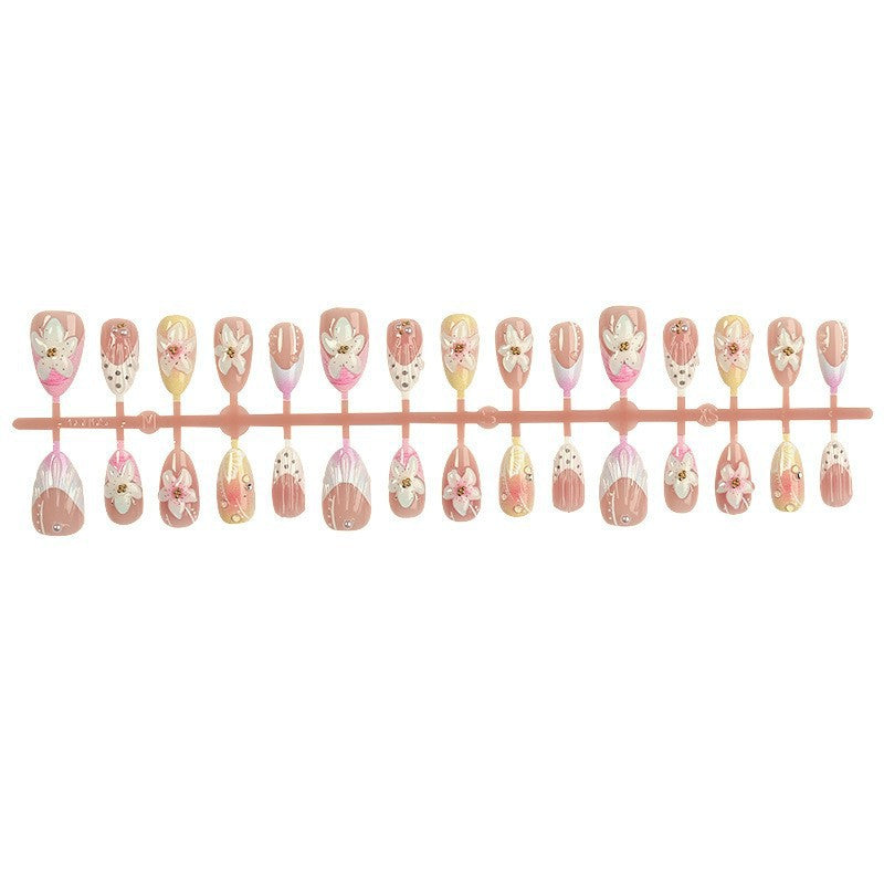 Artificial nail set with delicate floral designs and elegant accents Kalsten