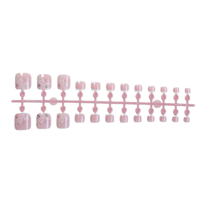 Nail art set with delicate floral design and glitter accents Kalsten
