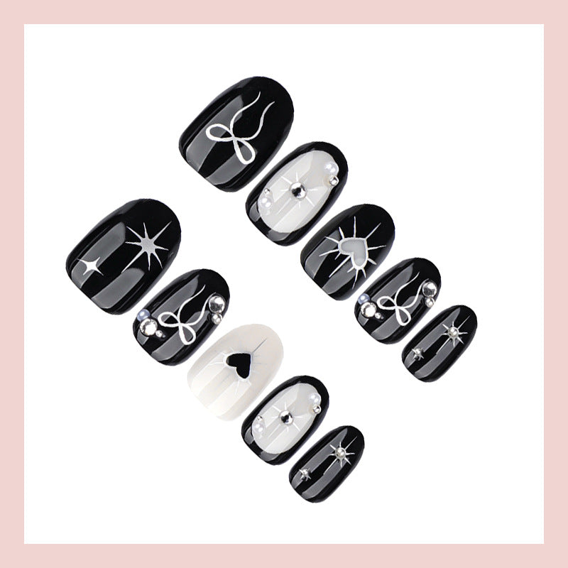 Artificial nail set with elegant bow and heart design Kalsten