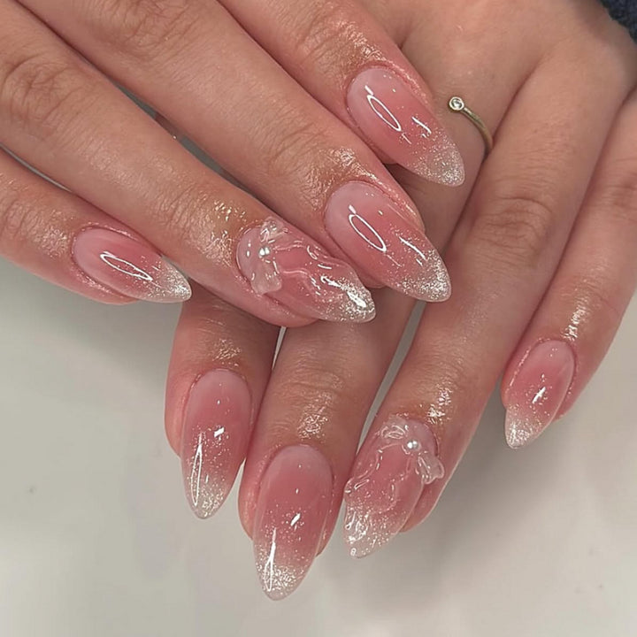 Artistic stiletto nails with elegant French tips and floral design Kalsten