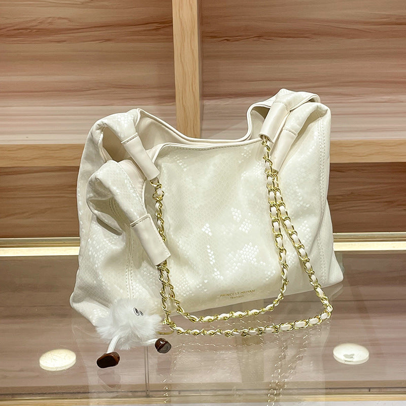 Chic Shoulder Bag with Decorative Charm