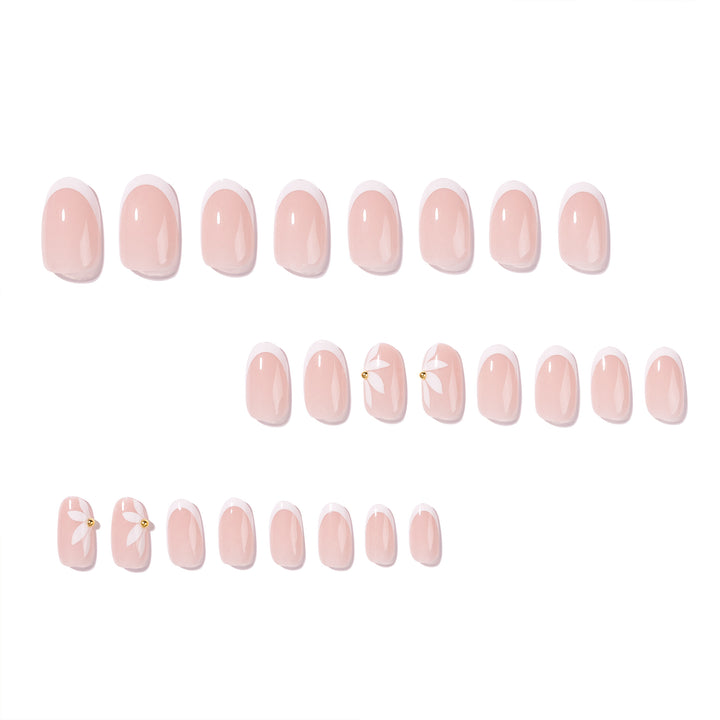 Artful French nails with delicate flowers and glitter accents Kalsten