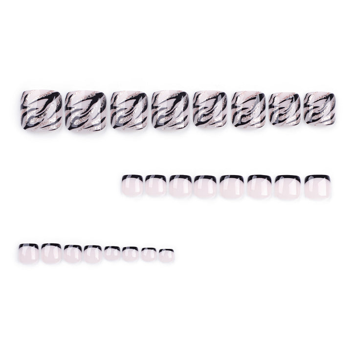 Artificial toenail art in elegant black and white design Kalsten