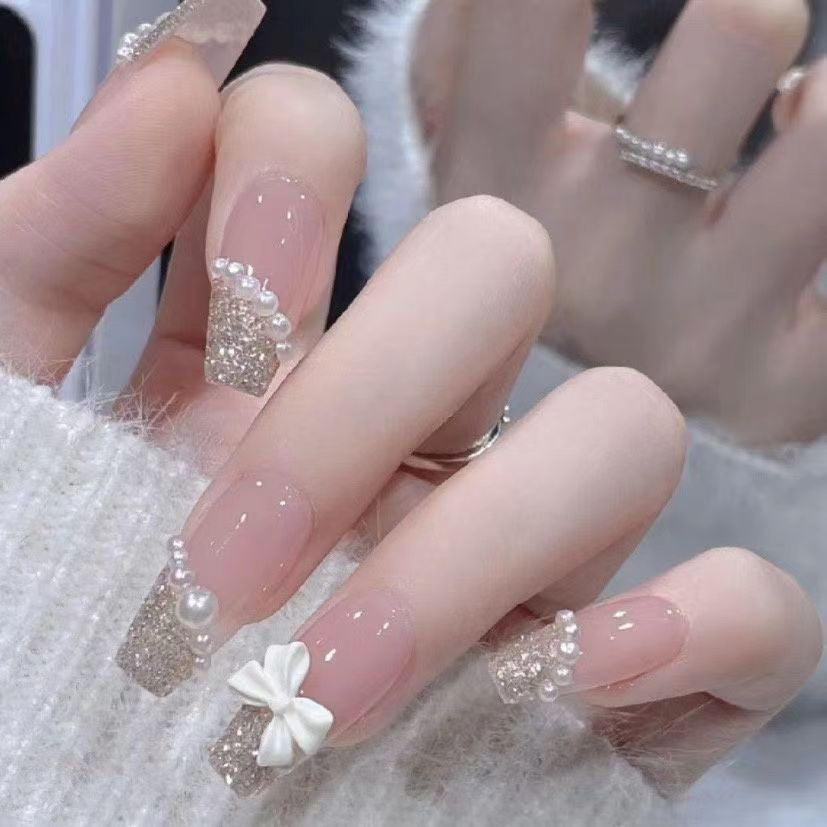 Artificial nails with glitter accents and playful motifs Kalsten