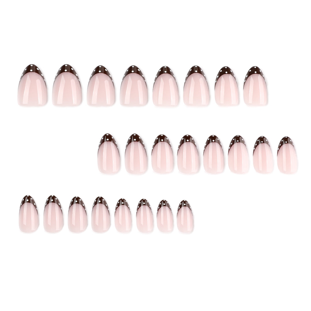 Artful nail art with elegant French tips and glitter accents Kalsten
