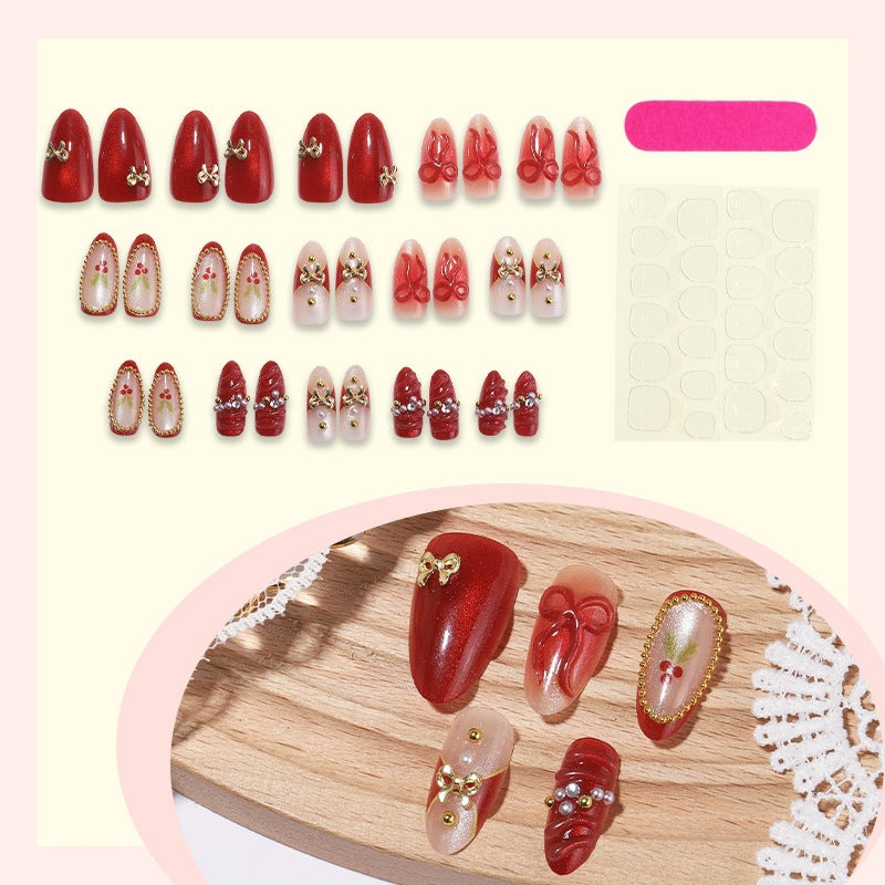 Acrylic nail set with festive designs and glitter elements Kalsten