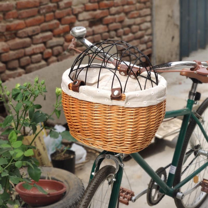 woven rattan pet carrier basket with detachable linen liner and foldable metal safety dome Kalsten