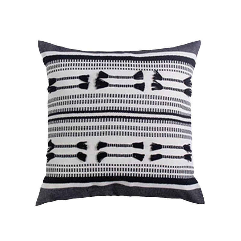 Woven decorative cushion cover with ordered tassel application and structured jacquard weaving Kalsten
