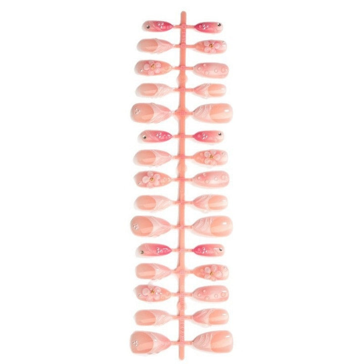 Artificial nail set with delicate floral and glitter accents Kalsten