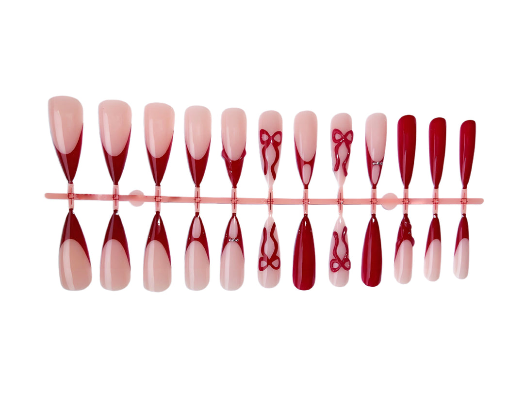 Artificial nails with elegant pointed designs and creative embellishments Kalsten