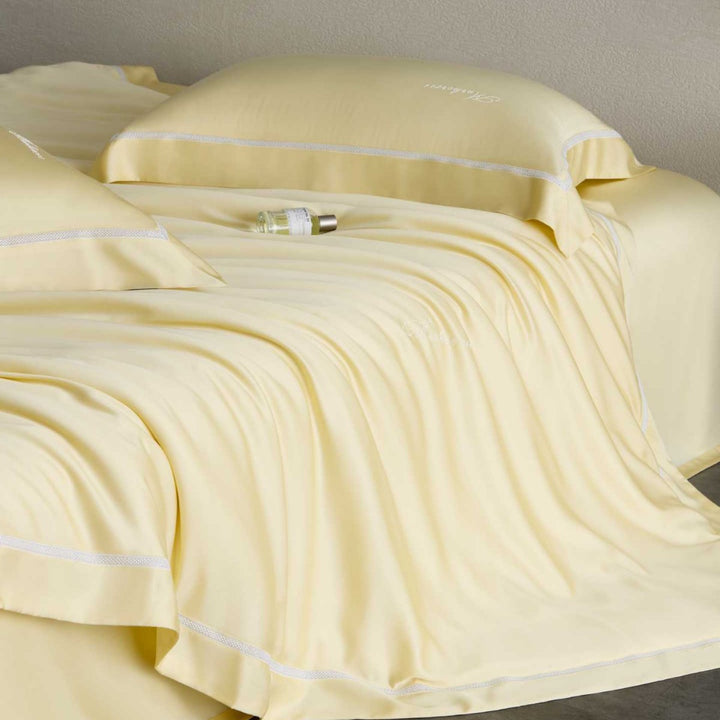 Silky-smooth cotton satin bedding set with fine decorative ribbon and pillowcases