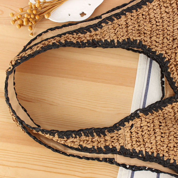 Beach shoulder bag made of handwoven natural material with comfortable carrying handles Kalsten