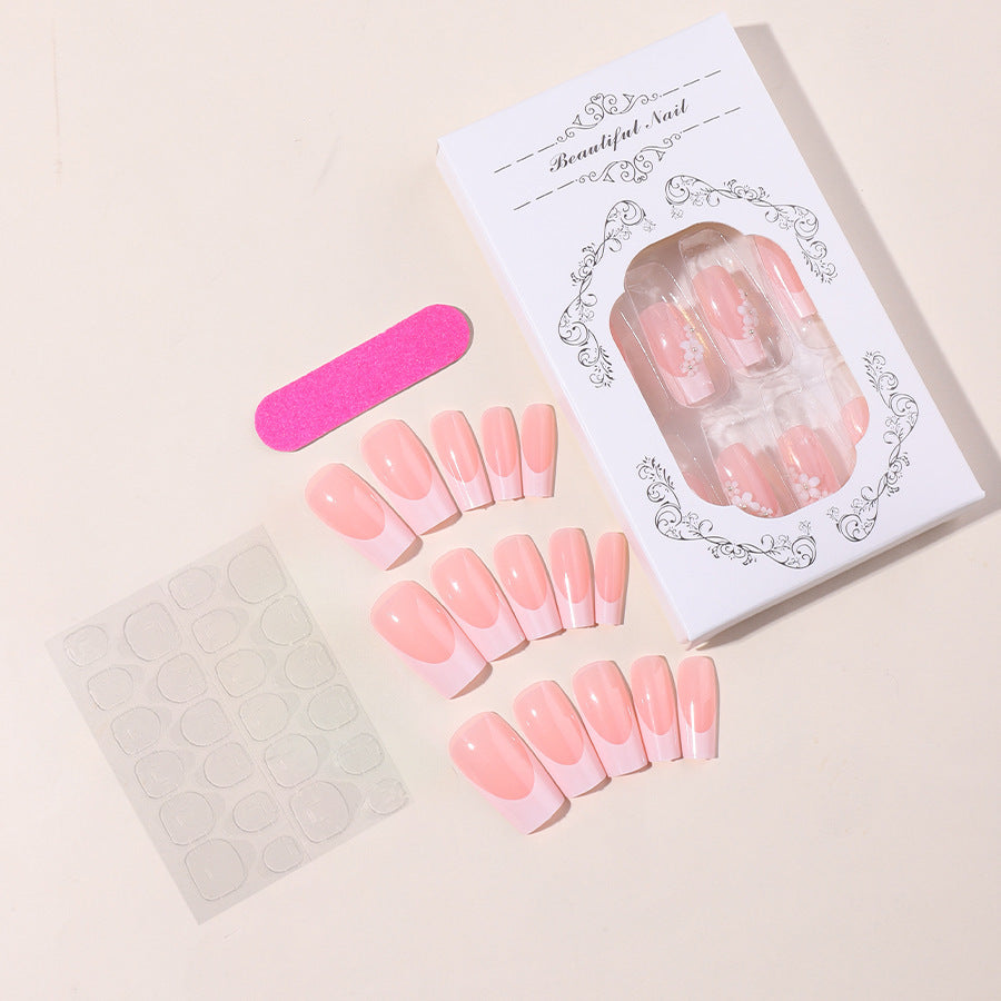 Artificial nail set with elegant French tips and hand-drawn flower motifs Kalsten