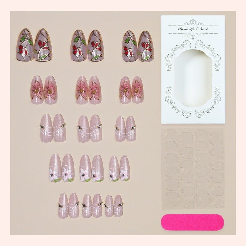 Artificial nail set with luxurious floral designs and glitter accents Kalsten