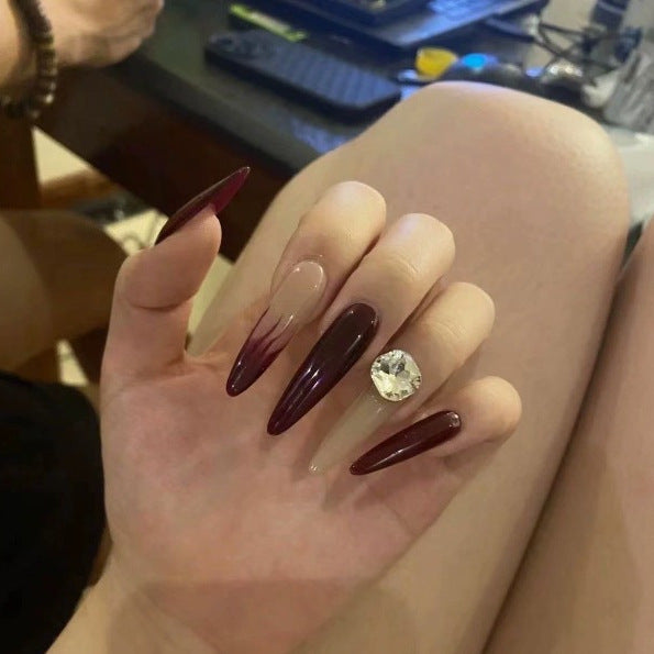 Elegant Stiletto Nail Enhancements with Gem Accents Kalsten
