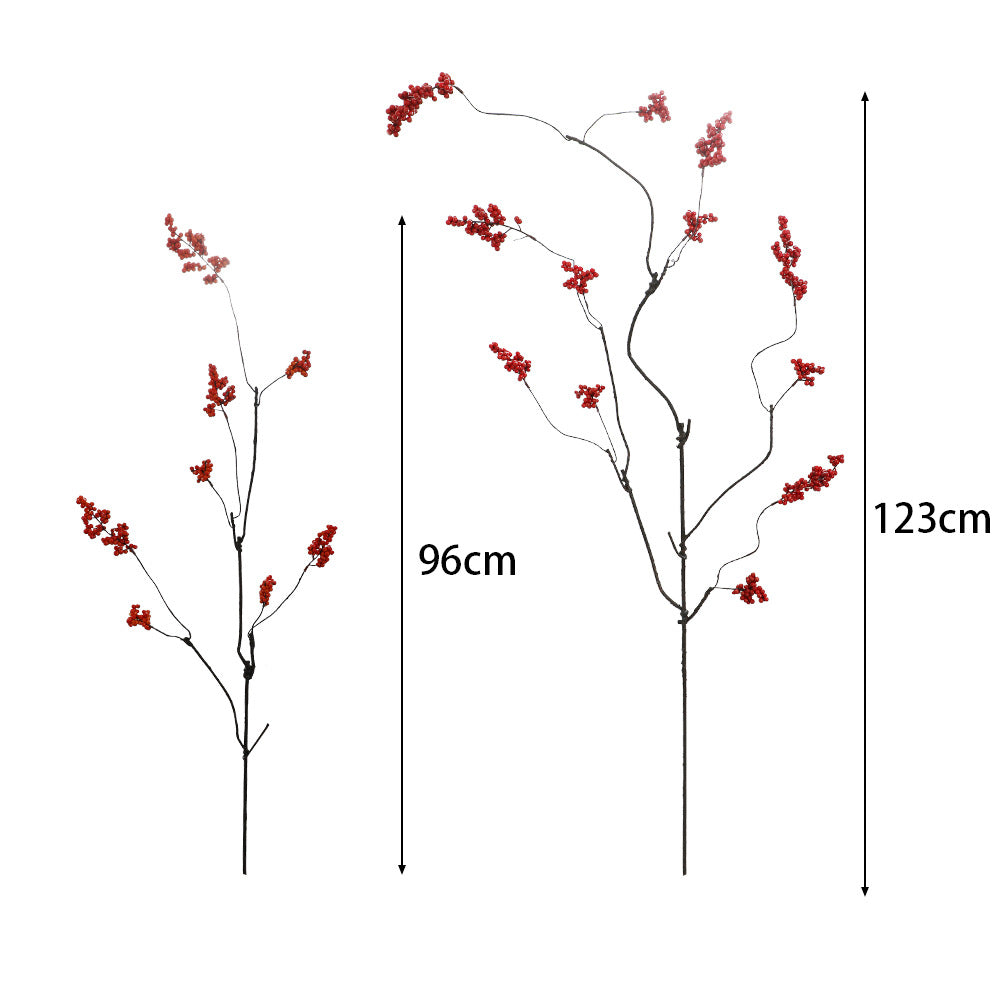 Decorative artificial flower branch with glowing red berries