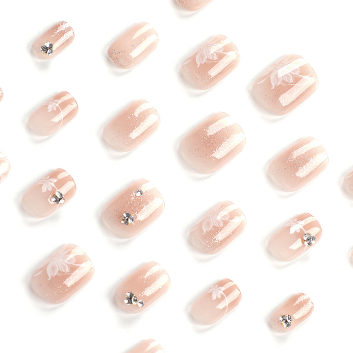 Elegant Nail Art with Holographic Accents and Floral Embellishments Kalsten