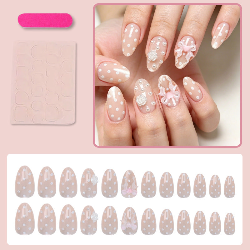 Art nail set with playful dots and romantic embellishments Kalsten