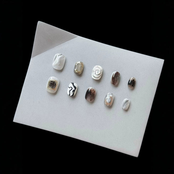 Artistic Press-On Nail Set with Modern Marble and Metallic Accents