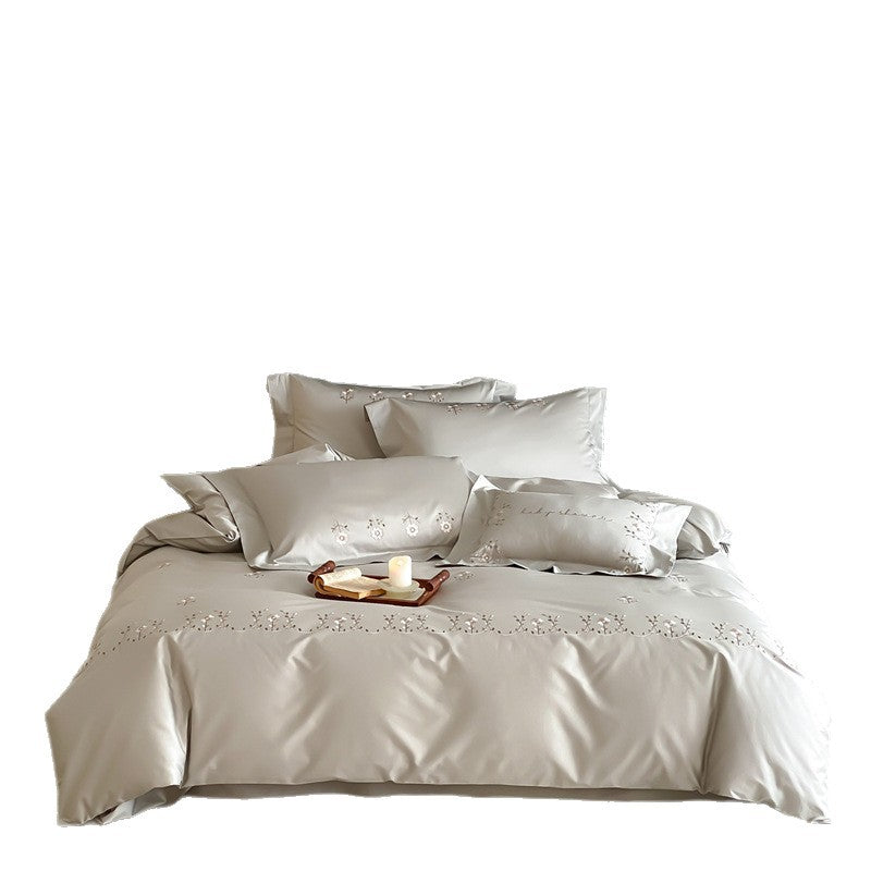 Satin bedding set with delicate flower embroidery and silk-soft touch