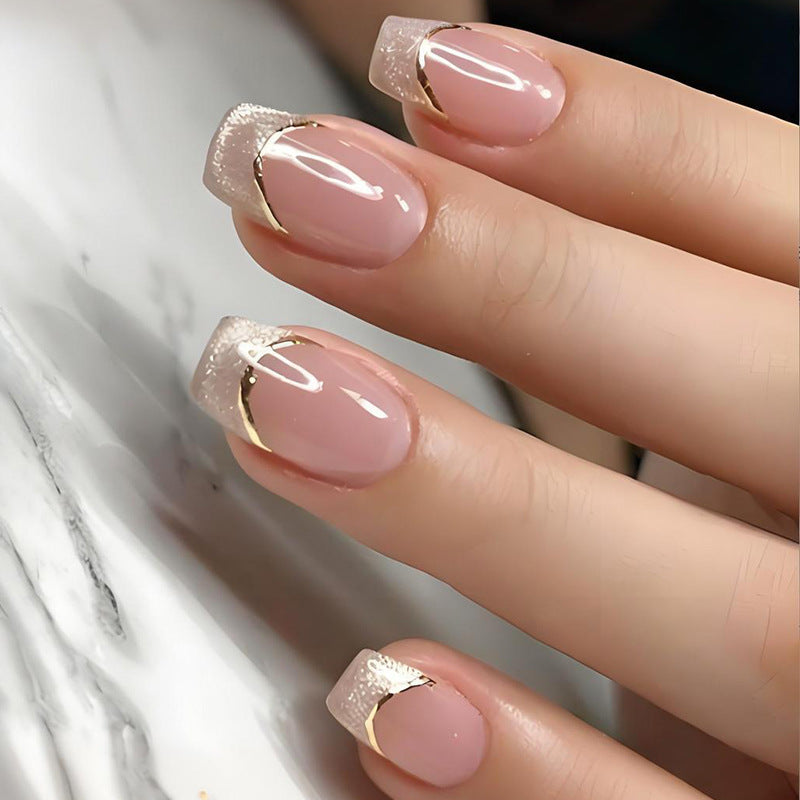Artificial nail set with elegant glitter French tips and golden embellishments Kalsten