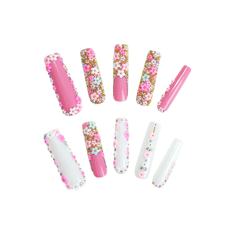 Artificial nail set with floral decorations and glitter accents Kalsten