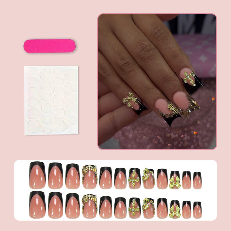Artificial nails with elegant gold decorations and stylish black Kalsten