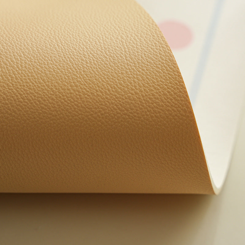 Oval wipeable placemat with pastel-colored polka dots Kalsten