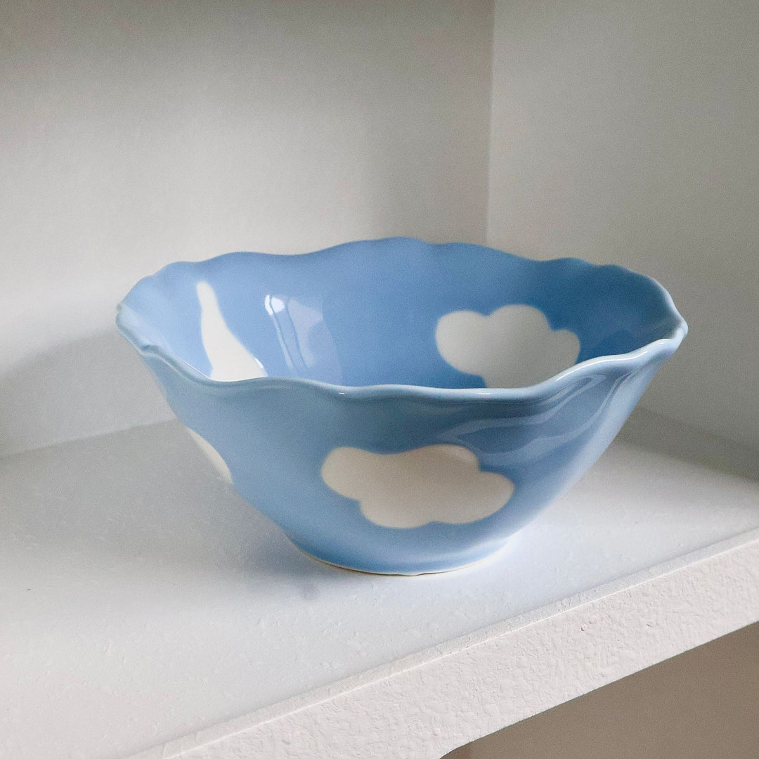 Decorative hand-painted ceramic bowl with wavy edge and tulip design