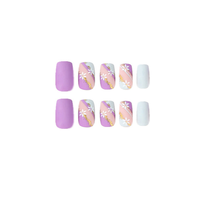 Artistic nail designs with floral motifs and glitter accents Kalsten