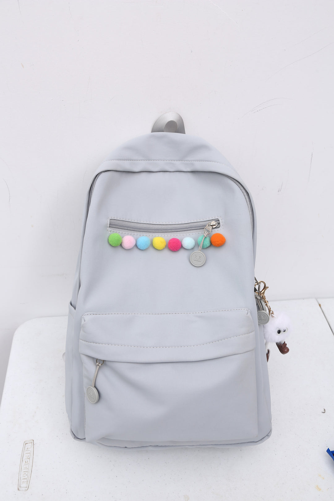 Practical backpack with colorful applications Kalsten