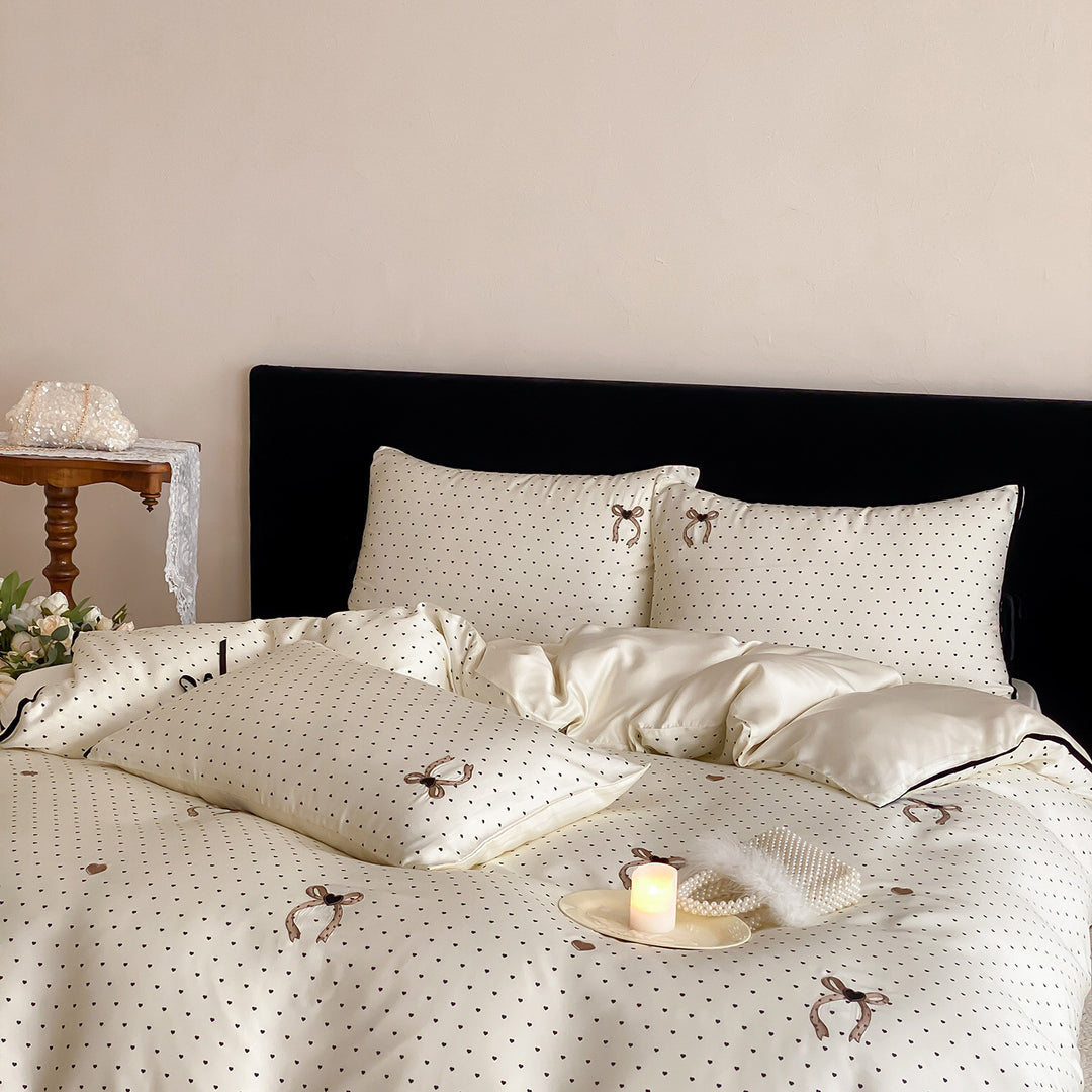 Luxurious satin bedding set with delicate polka dots and bow embroidery