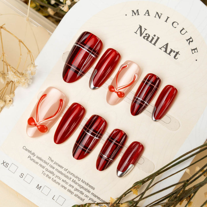 Art nail set with festive design and bow accents Kalsten