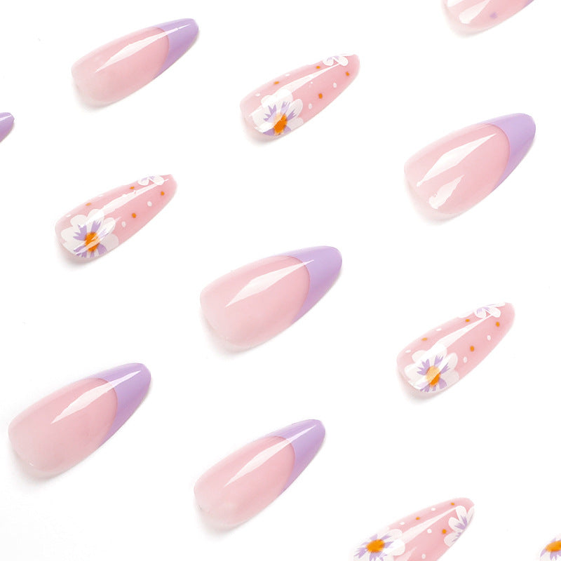 Artful nail art with floral accents and gradient colors Kalsten