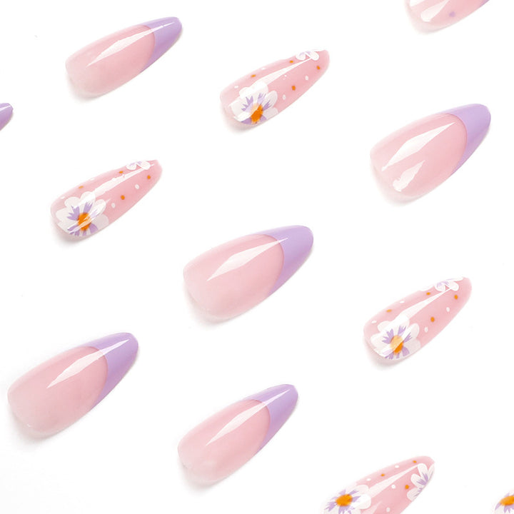 Artful nail art with floral accents and gradient colors Kalsten