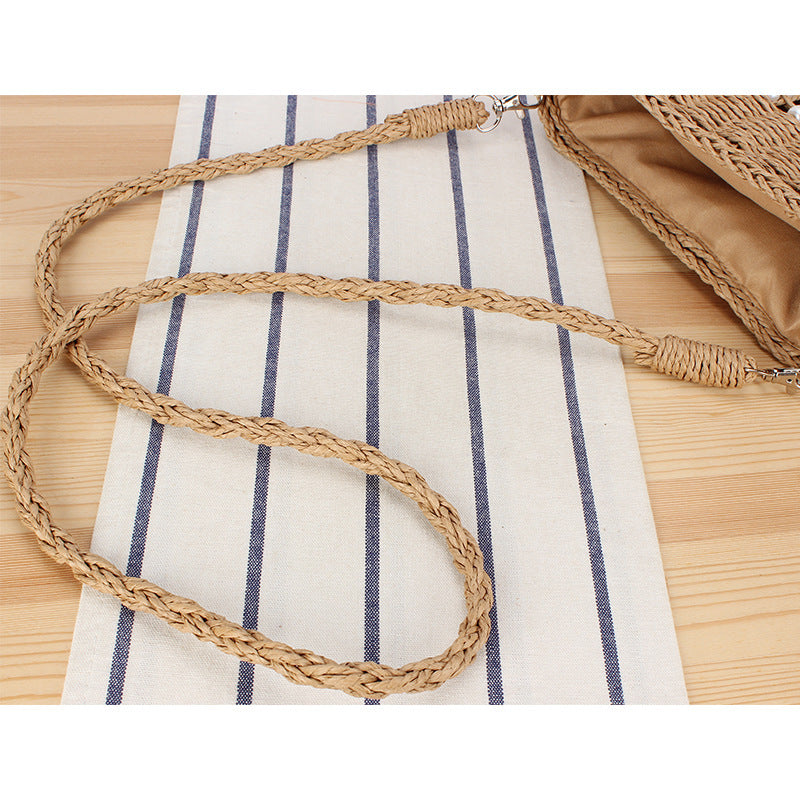 Handbag made of hand-woven natural material with pearl decoration Kalsten