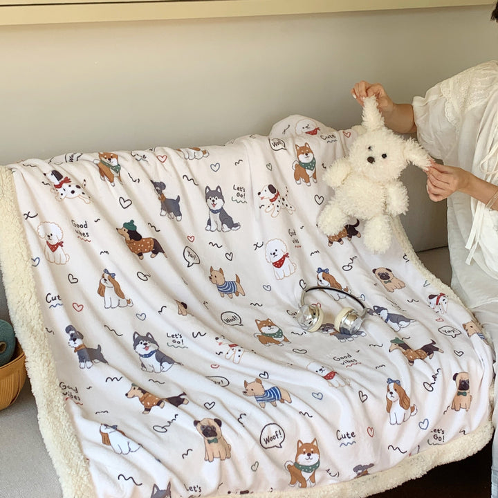 Reversible fleece blanket with cartoon cat design and teddy lining